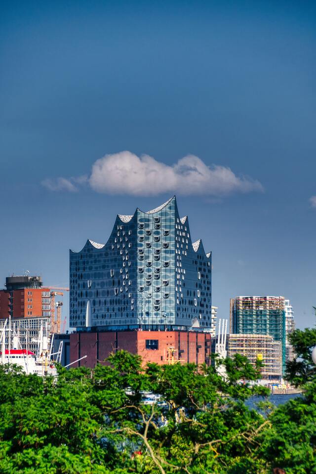 Hamburg Elbphilharmonie with green trees in the foreground